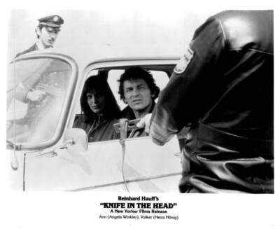 Angela Winkler sits in a car with Heinz Hoenig in 'Knife In The Hea Old Photo