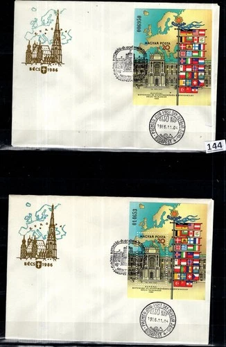 /// HUNGARY 1986 - 2 FDC - PERF+IMPERF - MAP, ARCHITECTURE, FLAGS