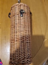A fine wicker basket to hold a bottle with leather strap great cond 15 in tall
