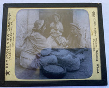 KEYSTONE MAGIC LANTERN SLIDE 498 WOMEN GRINDING WHEAT PALESTINE 1920s
