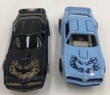 2 Tyco Slot Car  79 Pontiac Firebird Trans Am Curve Hugger Baby Blue  Black gold