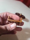 Miniature Dollhouse Table With Decor Attached And Unfinished Wood Sofa — photo 3