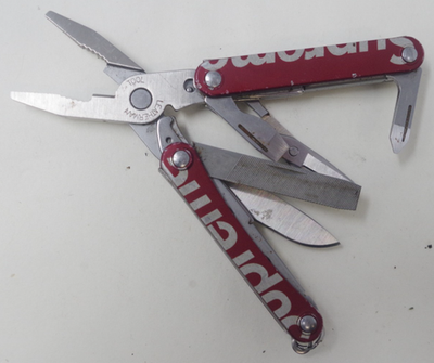 Retired Red Supreme Leatherman Squirt PS4 Multi-Tool Pocket Knife