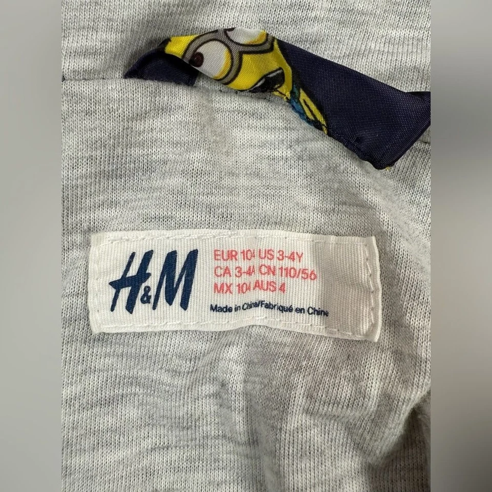 Chaqueta cortavientos con capucha y cremallera H&M Minions para niños 3-4 años Despicable Me divertida juguetona Foto 3 de 4