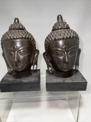2 METAL BUDDAH HEADS ON WOODEN BASES BOOKENDS BRONZE?
