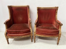 Deux bergères a oreilles de style Louis XVI en bois doré XX siècle