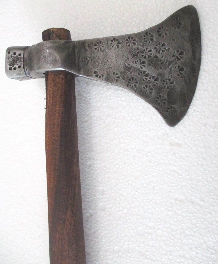 A beautifully designed antique axe-hammer hybrid that's more sculpture than tool — the kind of thing that ends up mounted on a wall.
