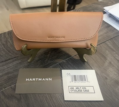 A contemporary Hartmann tan leather eyeglass case