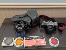 Canon AE-1 SLR Film Camera with lenses and bag