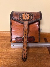 handmade, hand-tooled leather camera bag/clutch
