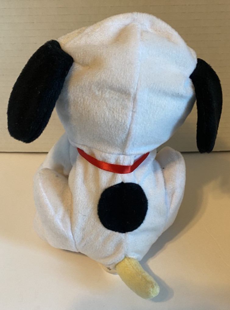 Raising Cane's Yellow Labrador dressed as snoopy Charlie brown Peanuts plush