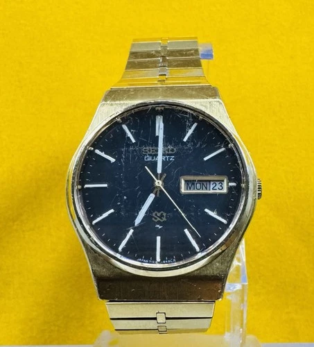 Vintage Seiko SQ Quartz 7123-840LR Day Date Gold Tone Integrated Bracelet Watch