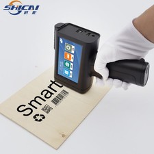 Handheld Inkjet Printer Prints Batch Number and Production Code on Paper Bags