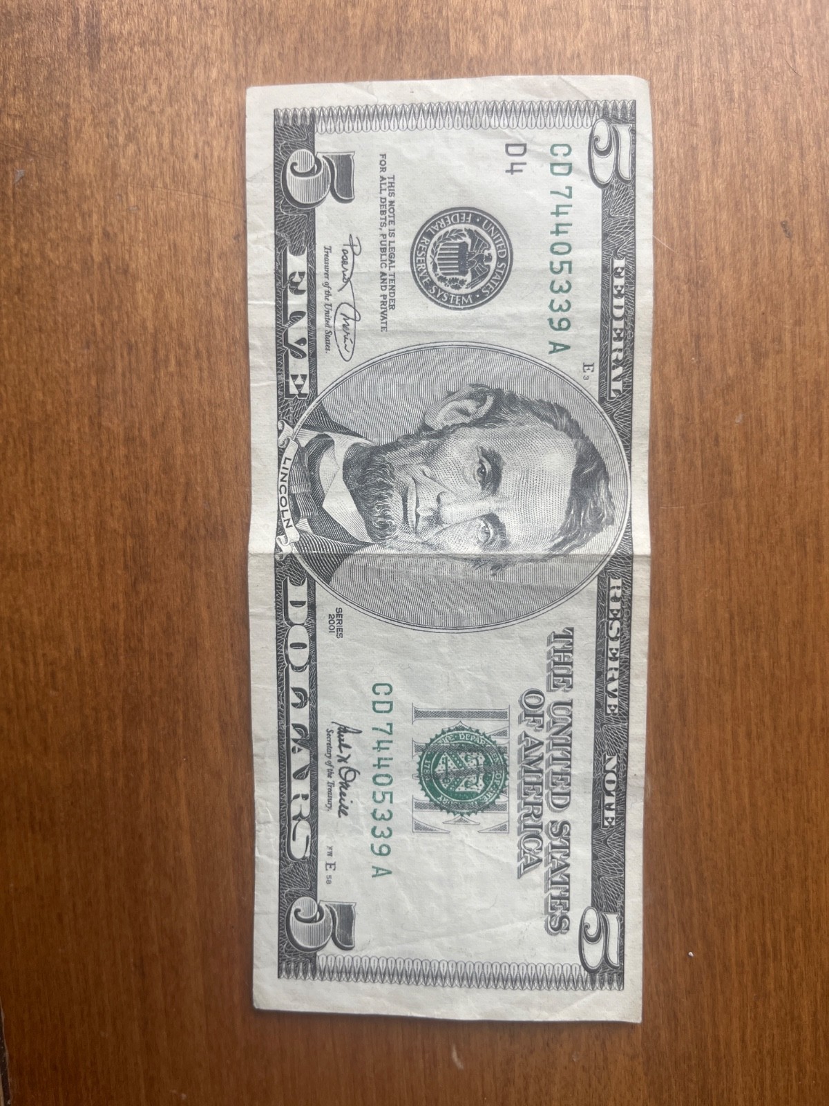 Good condition $5 US note from the 2001 series