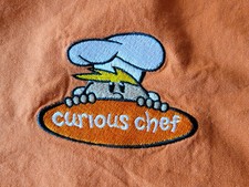 Curious Chef Kids Apron Yellow Orange Embroidered Logo Baker Cook Child