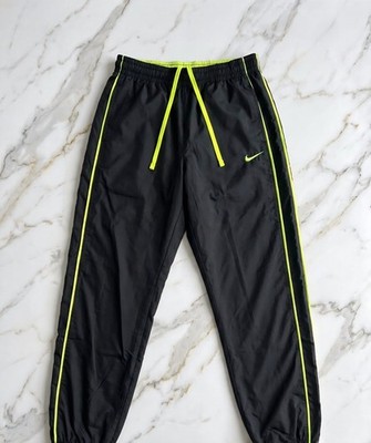 Nike the athletic dept. Trainingshose M schwarz/neongelb Zip-Tasche