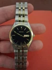 Mens Seiko 7N43-0BF0 Two Tone Watch Day/ Date With Black Dial Face