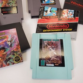 Lot of 8 NES Games Ikari Warriors II Jackal Trojan Strider Captain Comic CIB