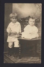 SNAPSHOT from ALBUM * Studio Real Photo Postcard Brothers little one on chair
