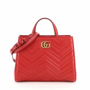 small red bolsa with handle