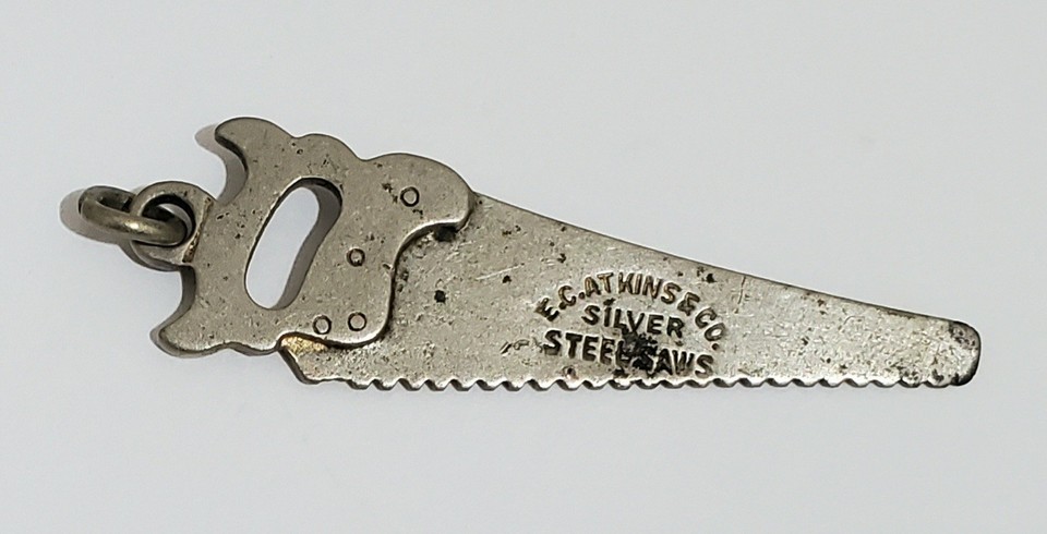 Miniature advertising pocket saw from E.C. Atkins & Co. — a tiny, tactile piece of American industrial history that fits in your palm.