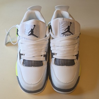 Brand new Air Jordan 4 Retro sneakers in White/Volt (Neon Yellow).