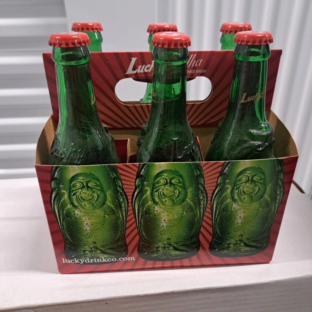 Budda beer bottles $20-  6 pack w/ carrying case and undamaged caps attached.