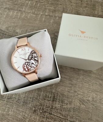 OLIVIA BURTON WATCH WITH 38MM WHITE FACE WITH ROSEGOLD BUTTERFLY WINGS PATTERN.