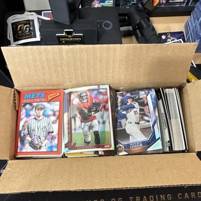 An assortment of all sports cards with some marvel, easily over 1000 card lot