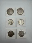 coins 2 Morgan silver dollars, and 4 ben franklin half coins showed in photo