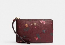 NWT COACH Black Cherry SMALL CORNER ZIP WRISTLET WITH Holiday Bells PRINT CE920
