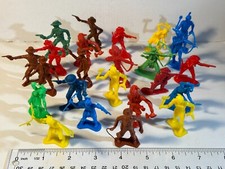 Lot of 24 assorted plastic Cowboy and Indian figures in various poses.