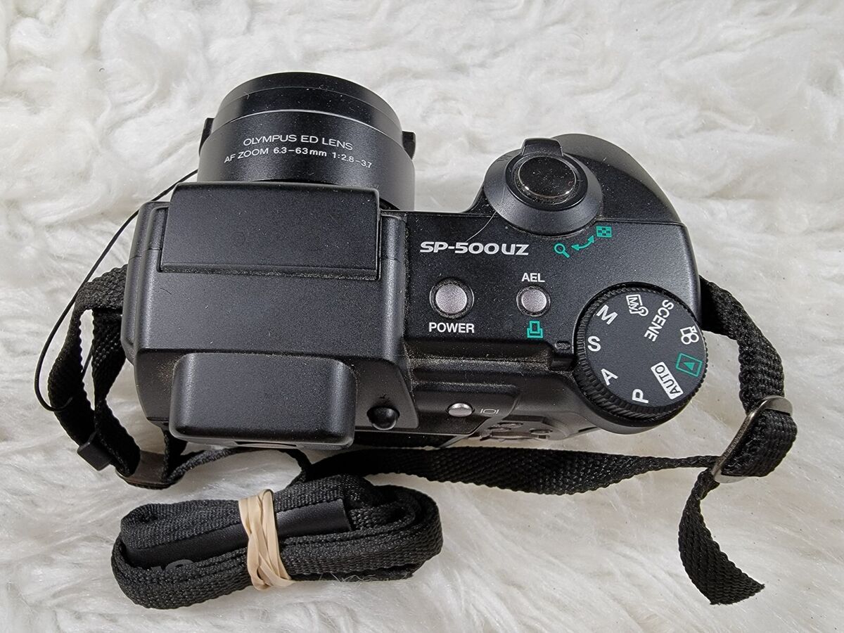 Olympus SP Series SP-500 UZ 6.0MP Digital Camera - Black Olympus SP Series SP-500 UZ 6.0MP Digital Camera - Black