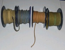 LOT OF 4 METAL SPOOLS RADIO WIRE CLOTH COVERED 22 GA. STRANDED 25FT OR LESS EA.
