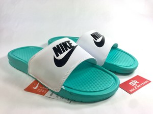 green and white nike slides