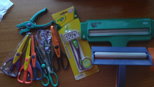 2 Crimpers, 6 pairs of paper edge scissors, 1 paper cutter and a star punch