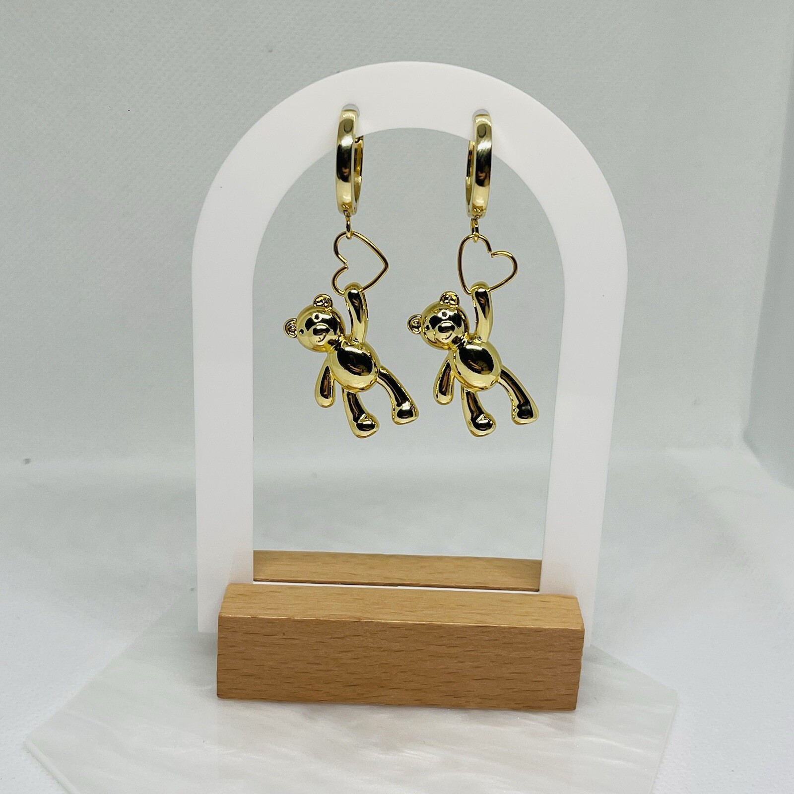 Gold plated hoops with teddy bear charm