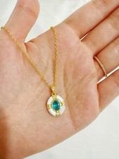 Brand new Yellow Gold necklace with blue gemstone Length 16-18in
