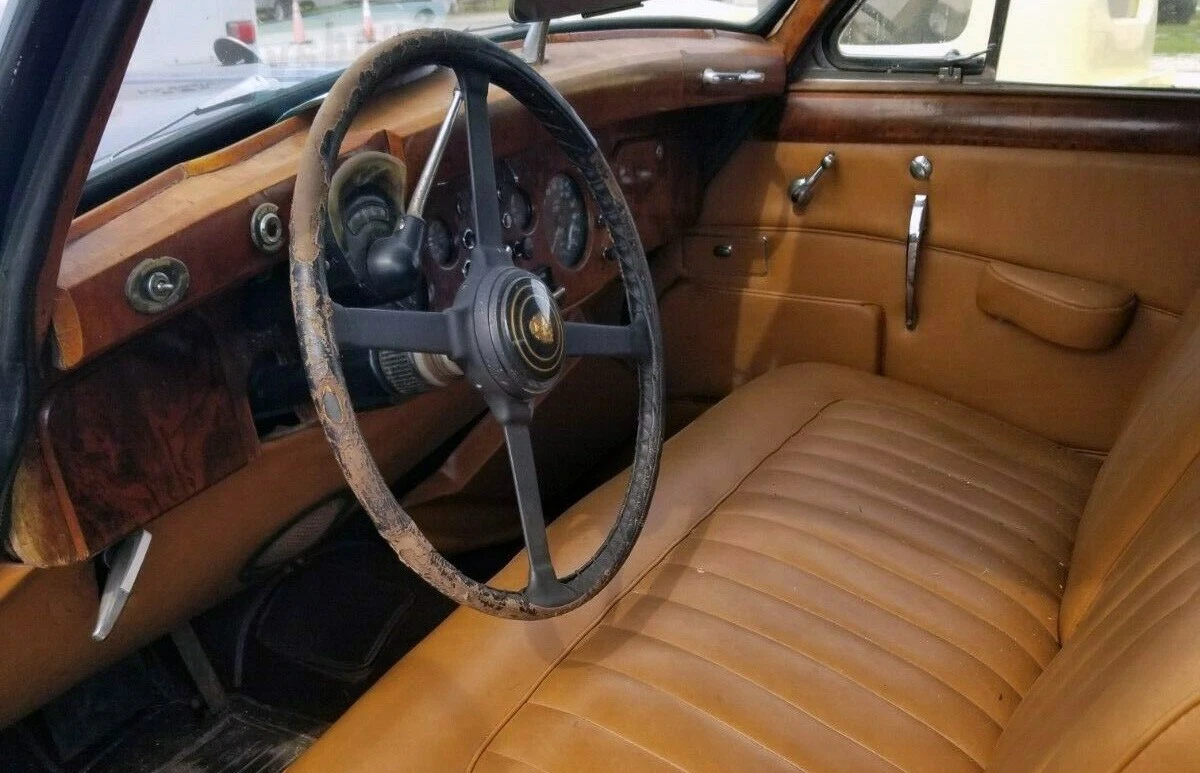 The burled wood and leather can be expensive to restore, but this car has a serviceable interior.