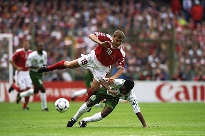 Ebbe Sand of Denmark is bundled over by Khamis Al Owairan of Saudi- Old Photo