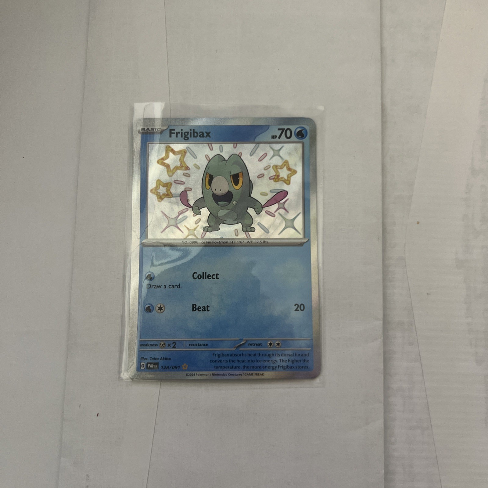Frigibax 128/091 Sv: Paldean Fates Holo NM