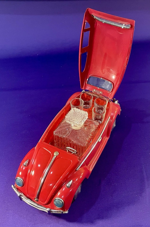 A 1960s VW Beetle-shaped Scotch whisky decanter that's also a music box — peak mid-century novelty kitsch that doubles as sculpture.