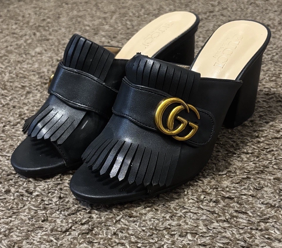 Gucci GG Marmot Kiltie Heel Mules in sleek black Marmot iconic gold logo accent. - Image 2 of 4