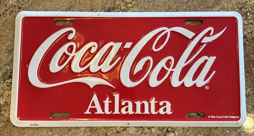 VTG Enjoy Coca Cola Atlanta Metal License Plate Red & White 09A-0063
