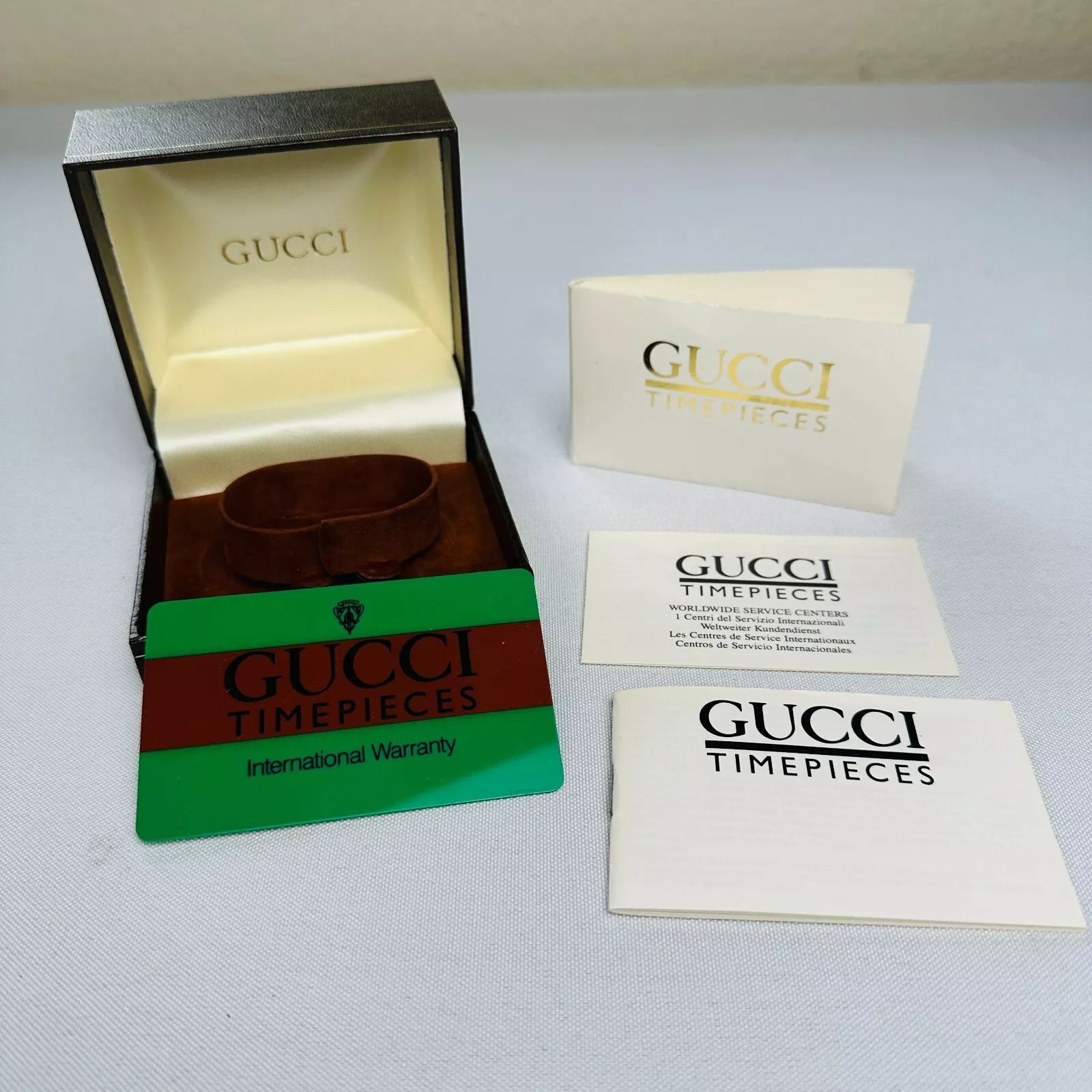 Ancienne boite montre Gucci et garde temps paperasse 1988 rare marron avec logo ton or