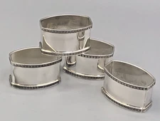 Set of 4 Sterling Silver Napkin Rings with 925 sterling mark and decorative edge