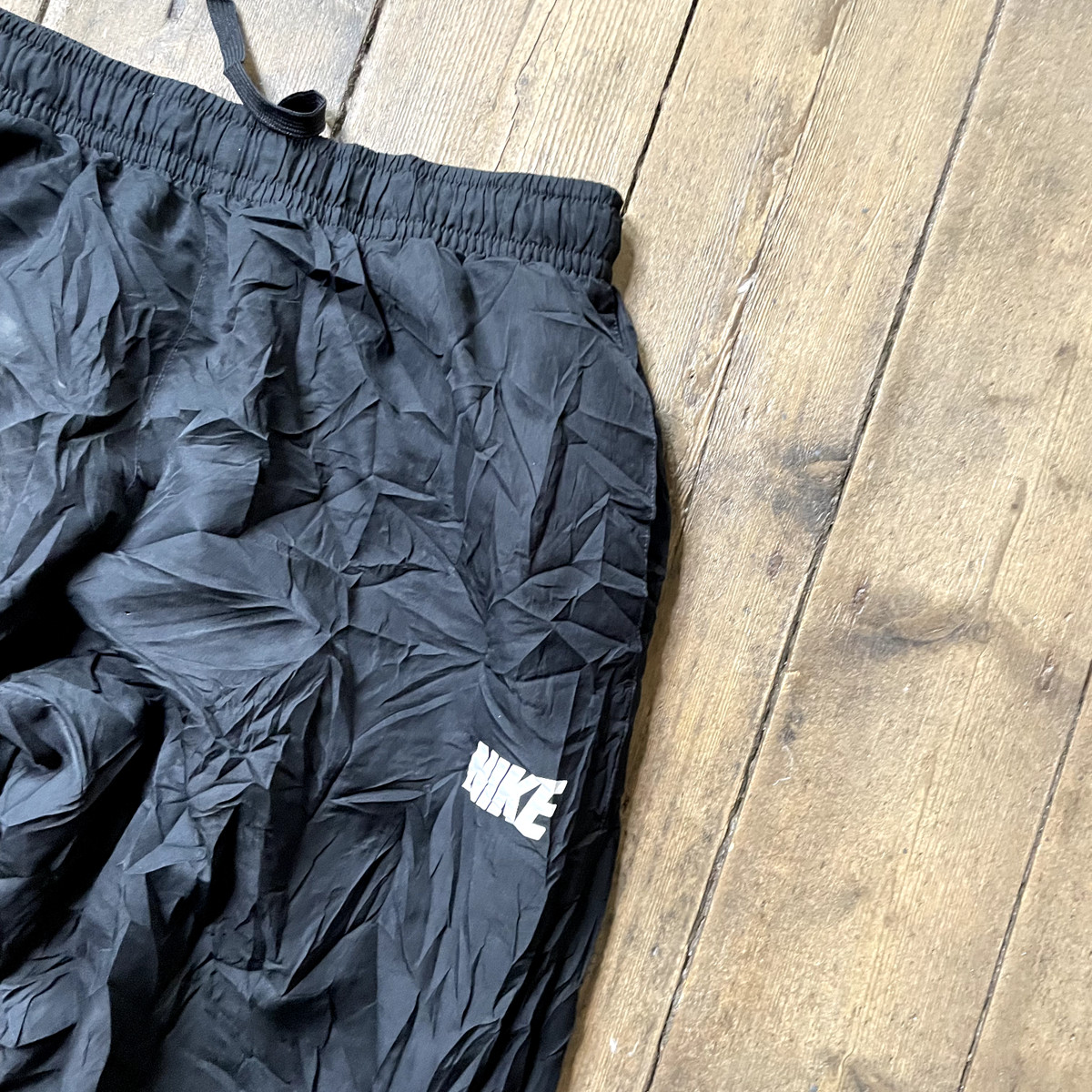 Swoosh tracksuit bottoms sales