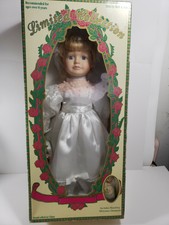 limited collection genuine porcelain doll and matching miniature ornament