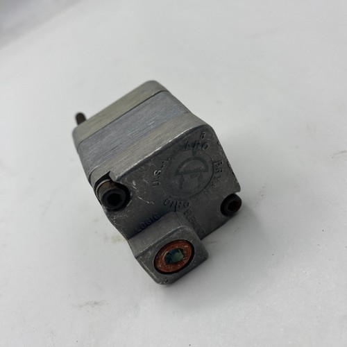 Silver ARO FLUID POWER 59111 PNEUMATIC LOGIC ELEMENT with black printed specifications and brass fitting, made in USA.