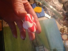 white and red peppermint swirl cabinet knob cover.